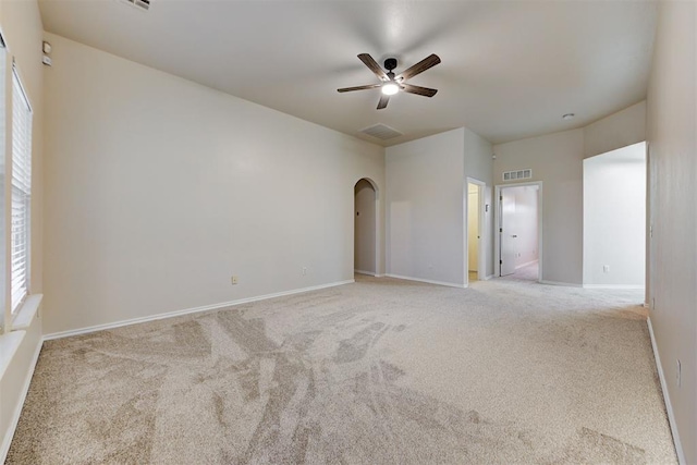 carpeted empty room featuring ceiling fan