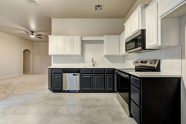 kitchen with white cabinets, ceiling fan, sink, and appliances with stainless steel finishes