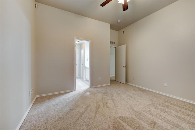 unfurnished bedroom with ceiling fan and light carpet