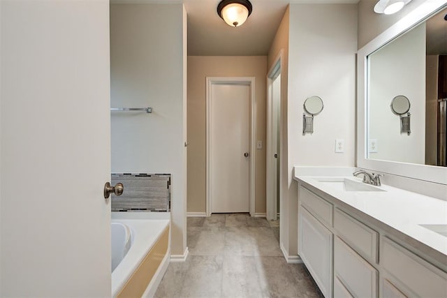 bathroom with vanity and a bathing tub