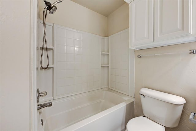 bathroom featuring shower / tub combination and toilet