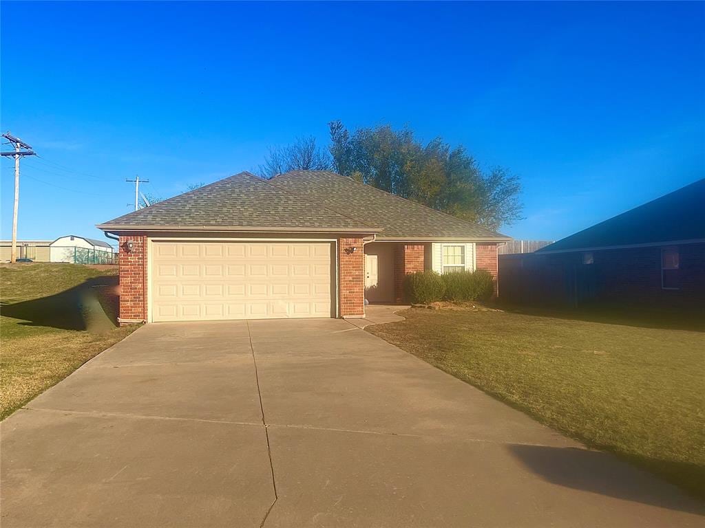 ranch-style house featuring a garage