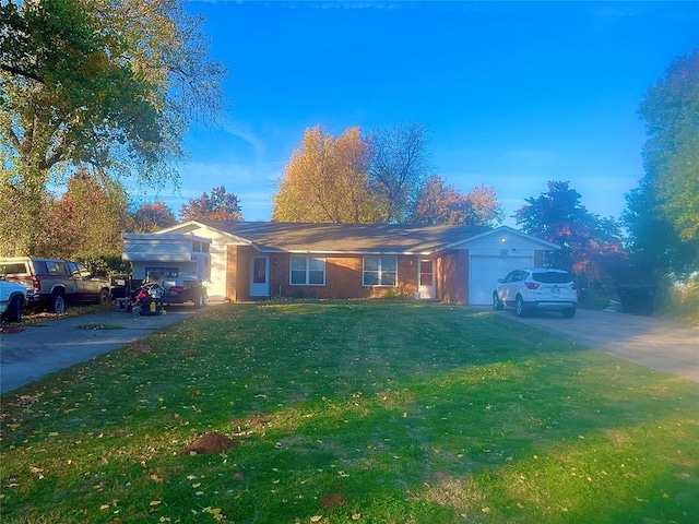 ranch-style house with a garage and a front lawn