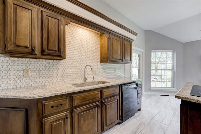 kitchen with dishwasher, sink, light stone counters, backsplash, and vaulted ceiling