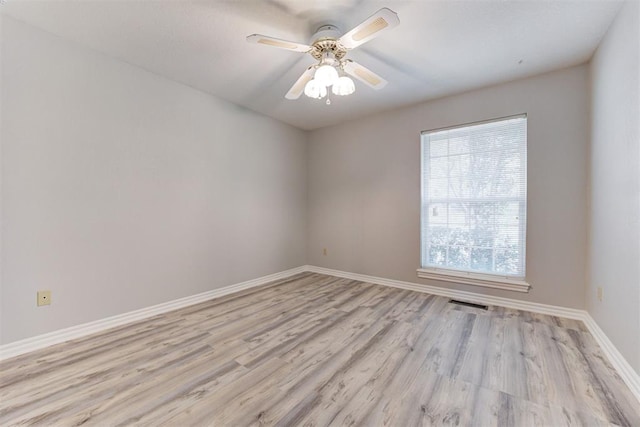 unfurnished room featuring ceiling fan and light hardwood / wood-style flooring