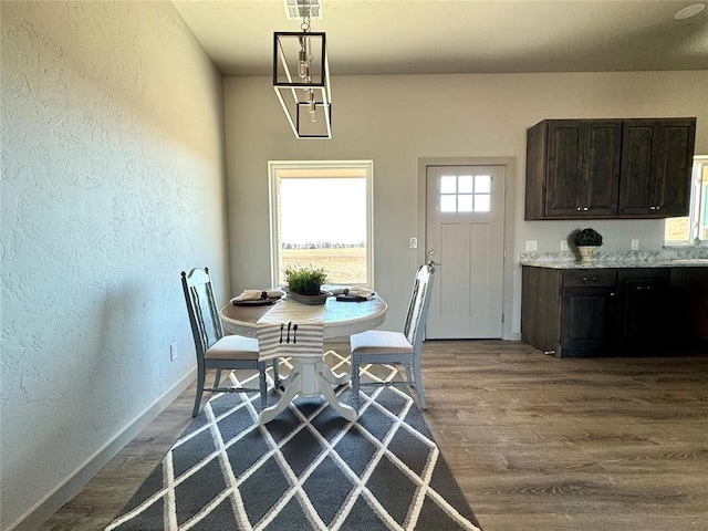 dining space featuring hardwood / wood-style flooring