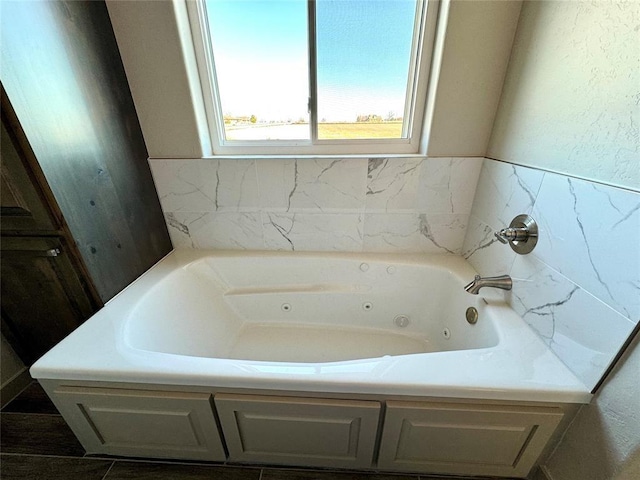 bathroom featuring a tub