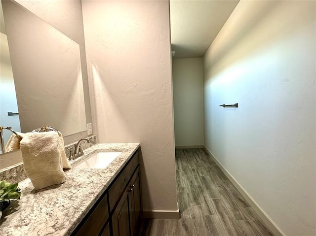 bathroom featuring hardwood / wood-style floors and vanity