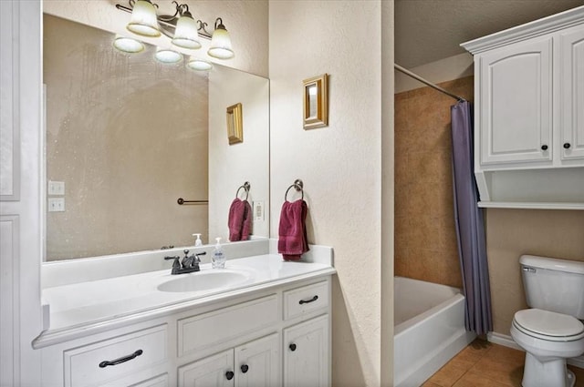 full bath with a textured wall, toilet, vanity, tile patterned floors, and shower / bath combination with curtain