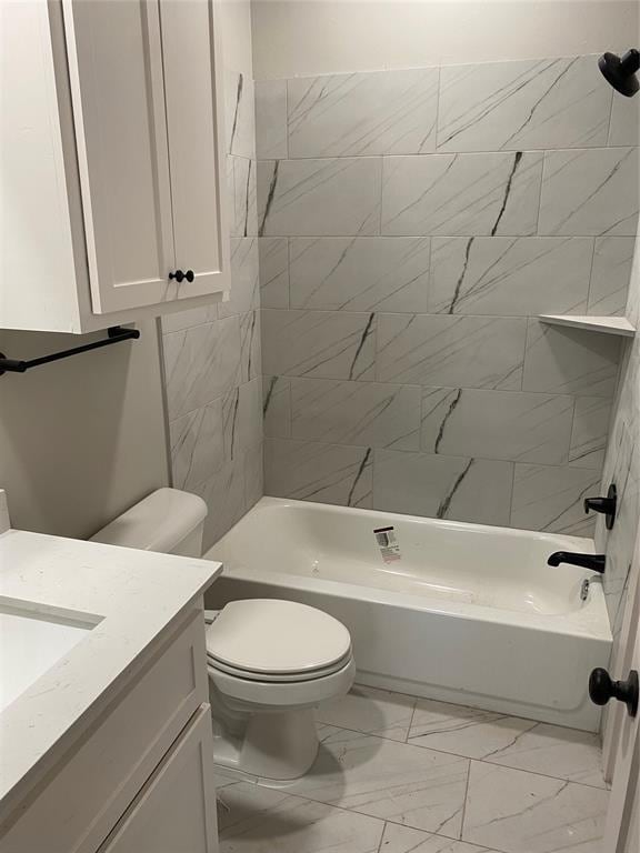 full bathroom with vanity, toilet, and tiled shower / bath combo