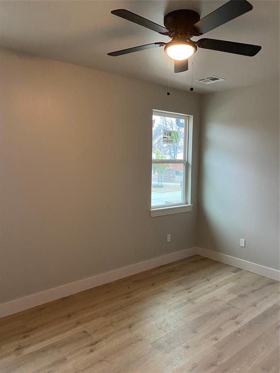 unfurnished room with ceiling fan and light hardwood / wood-style flooring