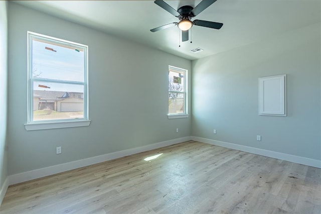 empty room featuring ceiling fan and light wood-type flooring