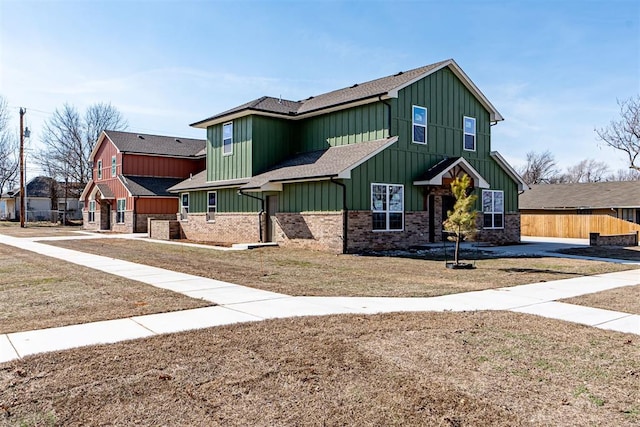 craftsman inspired home with a front yard