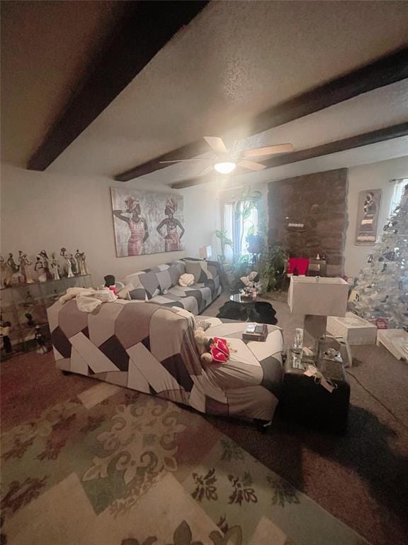 unfurnished bedroom featuring ceiling fan, beam ceiling, and carpet floors