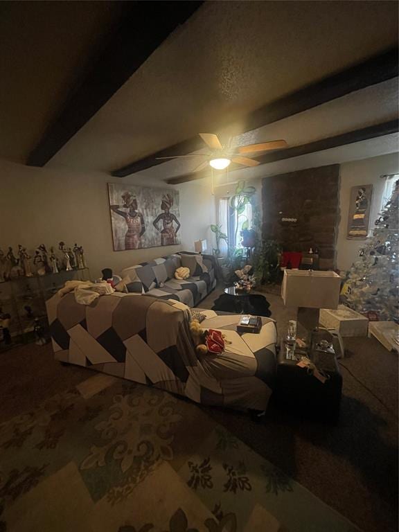 carpeted bedroom with beam ceiling and ceiling fan