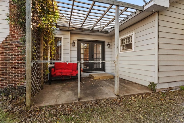 view of patio featuring a pergola and french doors