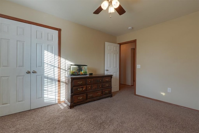 bedroom with carpet flooring, a closet, and ceiling fan