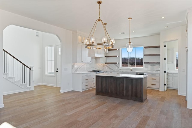 417 Basin Way, Norman, OK 73069 - kitchen featuring open shelves, light wood-type flooring, light countertops, plenty of natural light, and recessed lighting