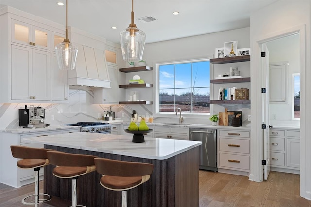 417 Basin Way, Norman, OK 73069 - kitchen featuring stainless steel appliances, open shelves, a sink, white cabinets, and recessed lighting