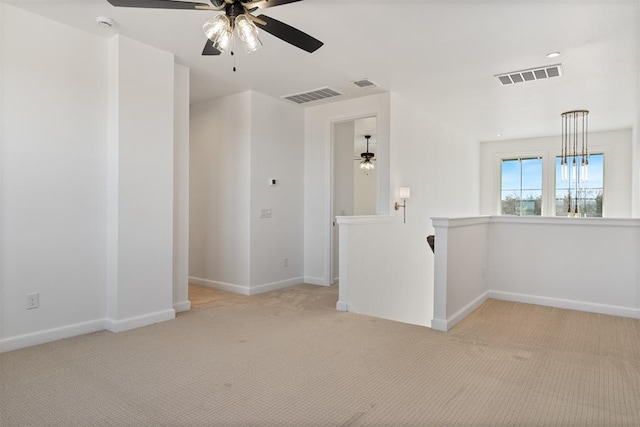 417 Basin Way, Norman, OK 73069 - spare room featuring light colored carpet, a ceiling fan, and baseboards