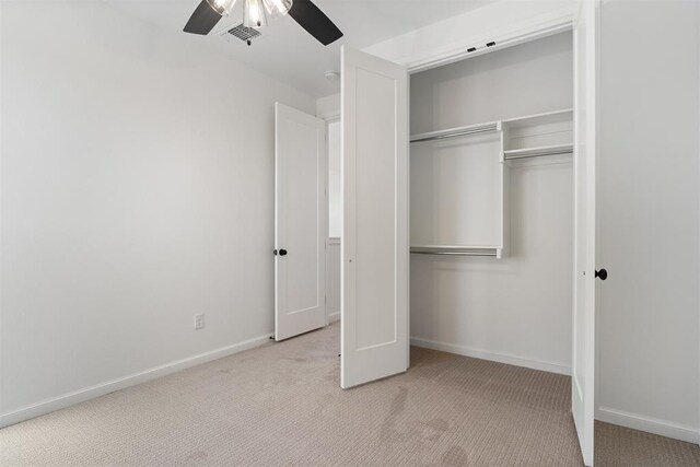 417 Basin Way, Norman, OK 73069 - unfurnished bedroom with carpet floors, a closet, baseboards, and a ceiling fan