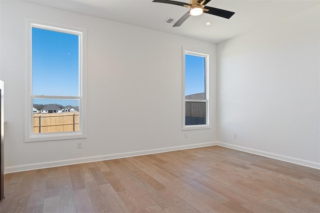 417 Basin Way, Norman, OK 73069 - spare room featuring wood finished floors, plenty of natural light, a ceiling fan, and recessed lighting