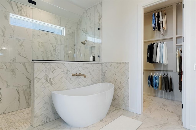 417 Basin Way, Norman, OK 73069 - full bath with a freestanding bath, a walk in shower, a walk in closet, marble finish floors, and tile walls