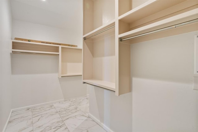 417 Basin Way, Norman, OK 73069 - walk in closet featuring light marble finish floors