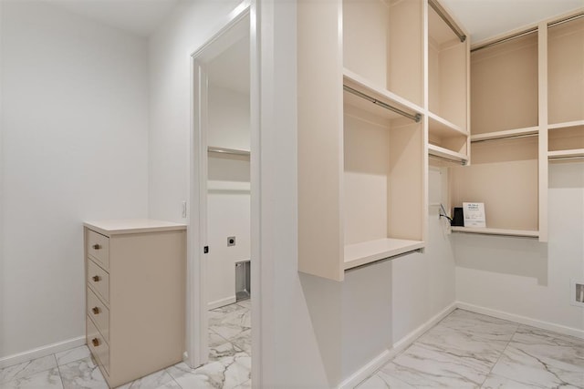 417 Basin Way, Norman, OK 73069 - walk in closet featuring light marble finish flooring