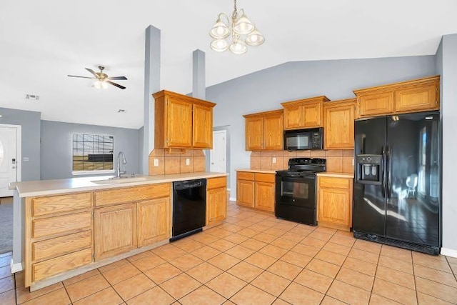 kitchen featuring ceiling fan with notable chandelier, light tile patterned floors, sink, and black appliances