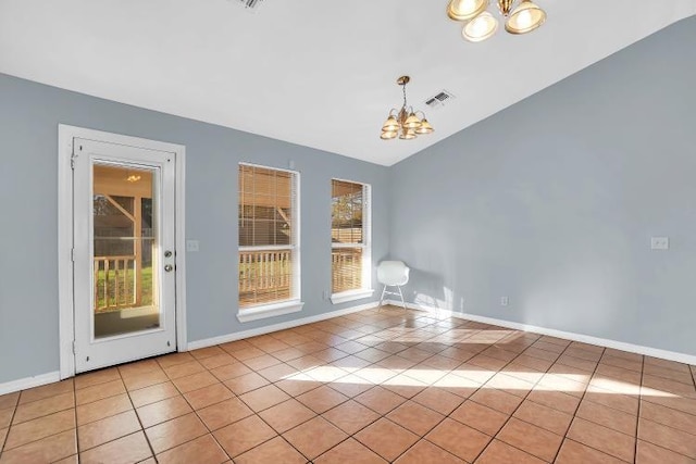 interior space featuring light tile patterned floors, a wealth of natural light, and an inviting chandelier