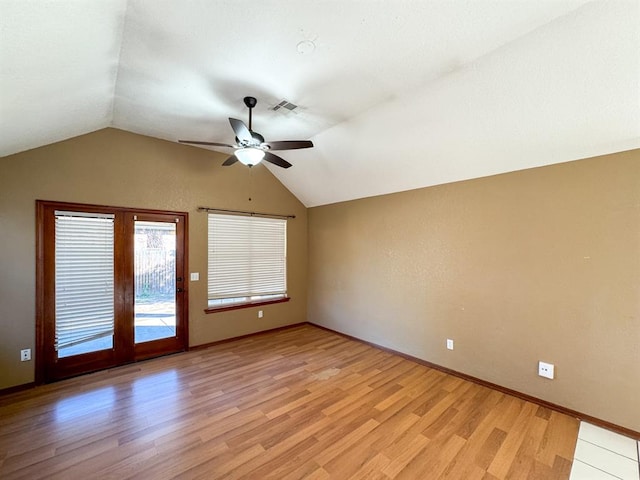 unfurnished room featuring ceiling fan, light hardwood / wood-style flooring, and vaulted ceiling