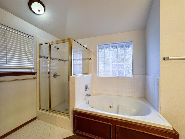 bathroom with tile patterned flooring and independent shower and bath