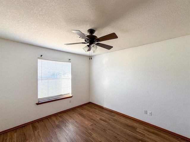 empty room with a textured ceiling, hardwood / wood-style flooring, and ceiling fan