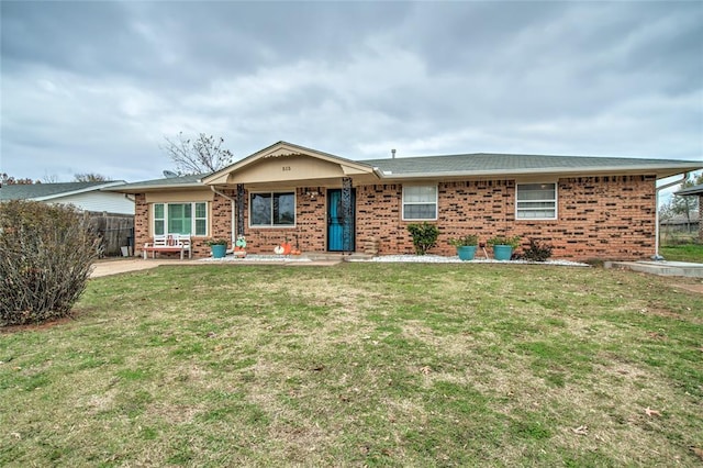 ranch-style home with a patio and a front yard