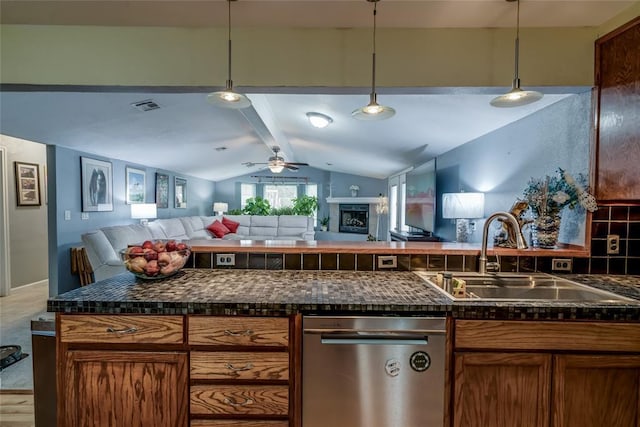 kitchen featuring stainless steel dishwasher, lofted ceiling with beams, sink, and pendant lighting