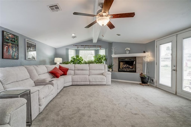 living room featuring ceiling fan, light carpet, lofted ceiling with beams, and french doors