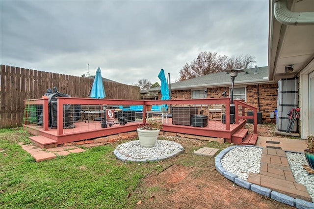 view of yard with a wooden deck