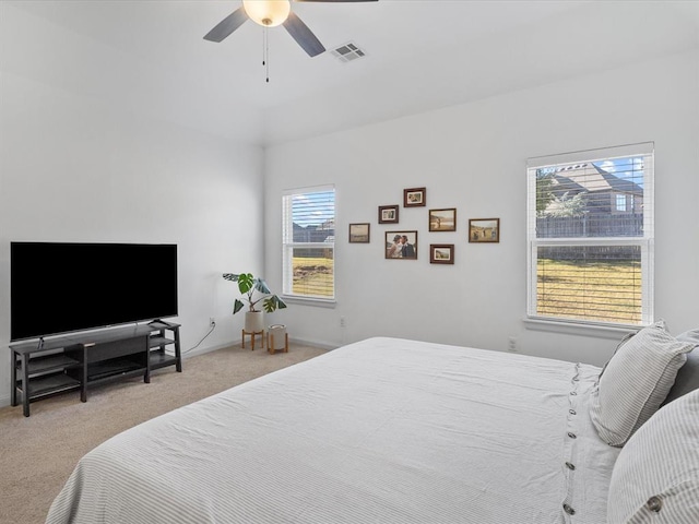 carpeted bedroom with ceiling fan