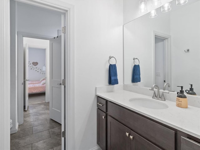 bathroom featuring tile patterned flooring and vanity