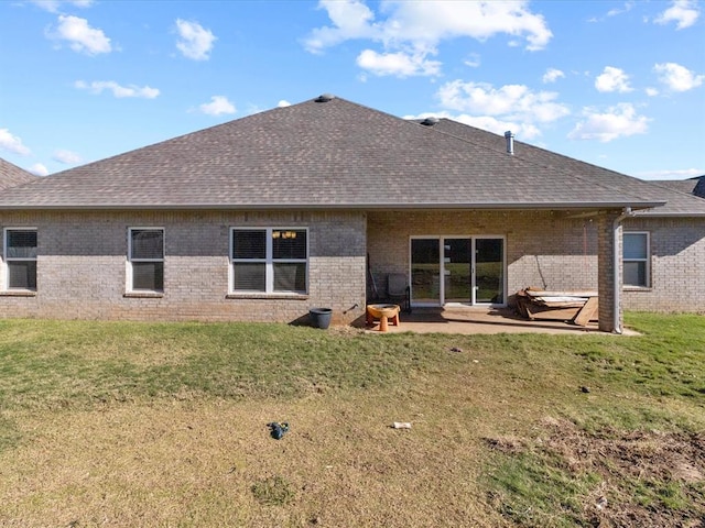 rear view of property with a patio area and a lawn