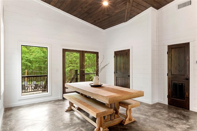 dining area featuring wood ceiling, high vaulted ceiling, and french doors