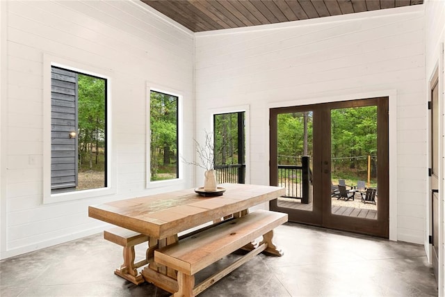 sunroom with french doors, wood ceiling, and vaulted ceiling