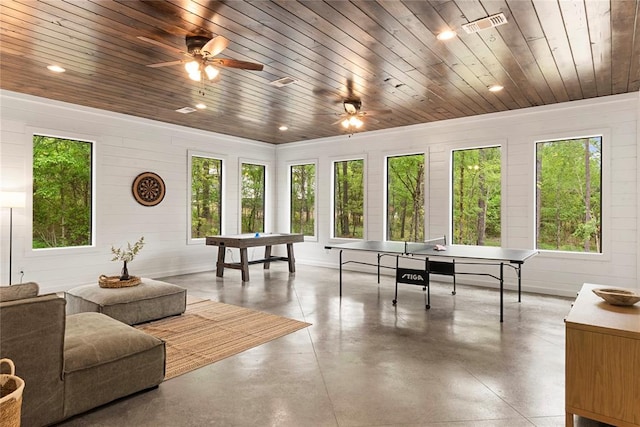 game room featuring pool table, wooden ceiling, a wealth of natural light, and concrete floors