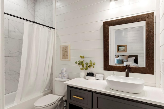 full bathroom featuring vanity, wooden walls, shower / bathtub combination with curtain, and toilet