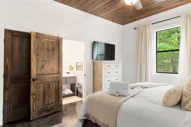 bedroom with connected bathroom, ceiling fan, and wooden ceiling