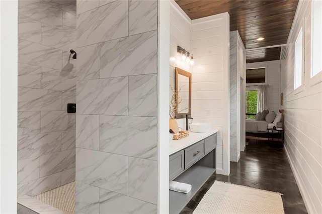 bathroom featuring vanity, a shower, and wood ceiling