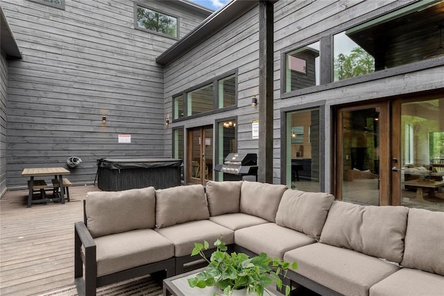 wooden terrace featuring a grill and french doors