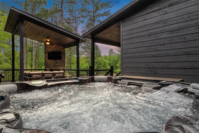 patio terrace at dusk with a hot tub