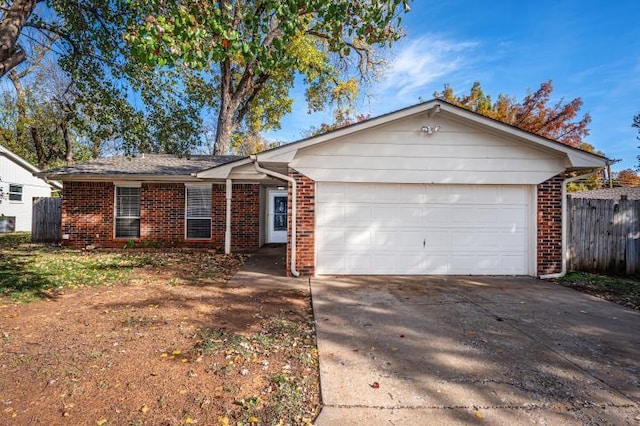 ranch-style home featuring a garage